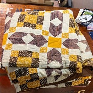 Patchwork Quilt with Yellow and Brown Accents